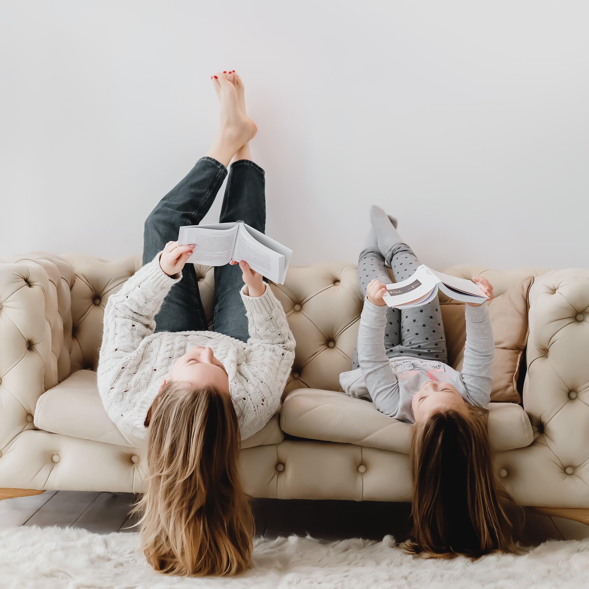 Mom and daughter reading upside down